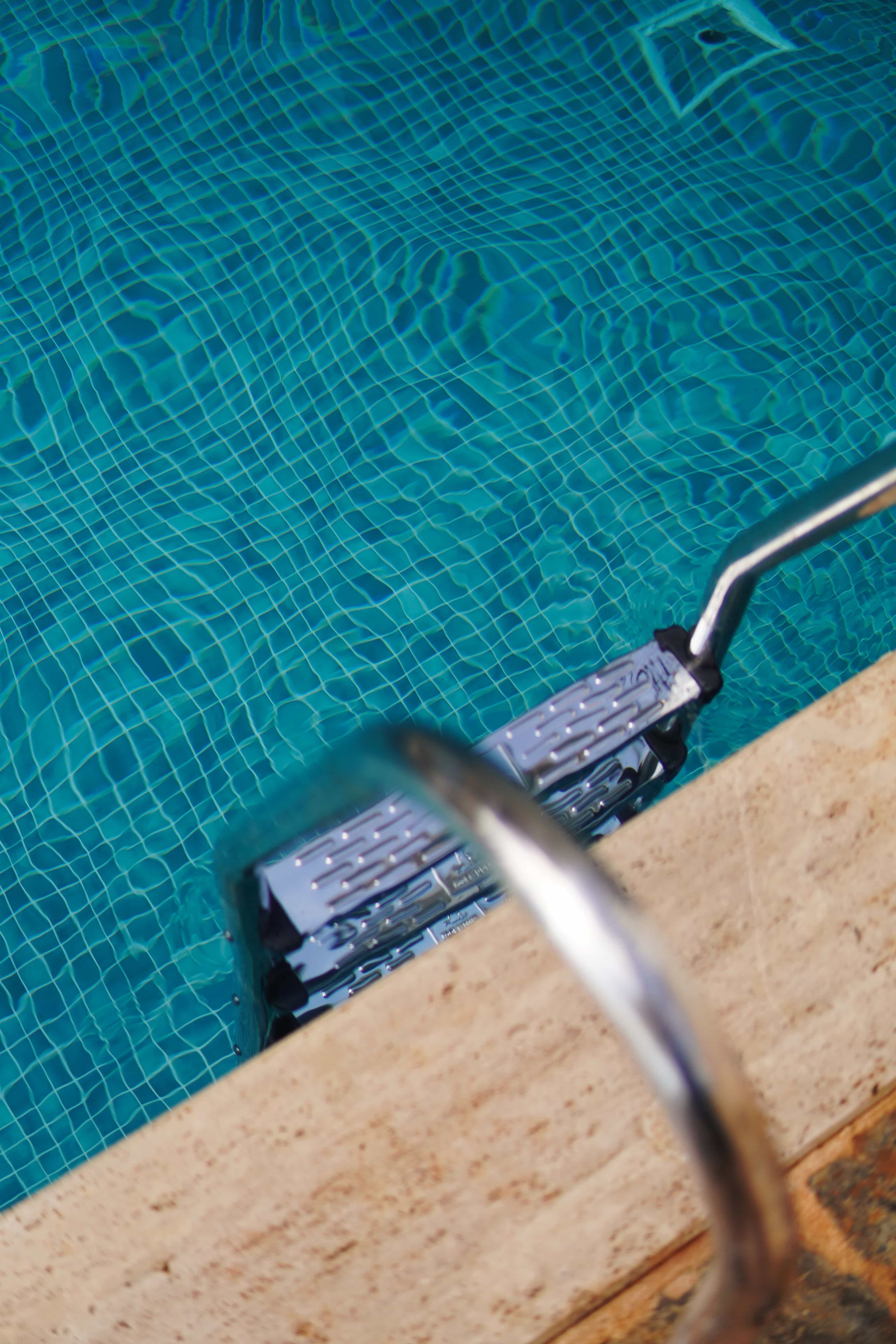 Step ladder going into a pool